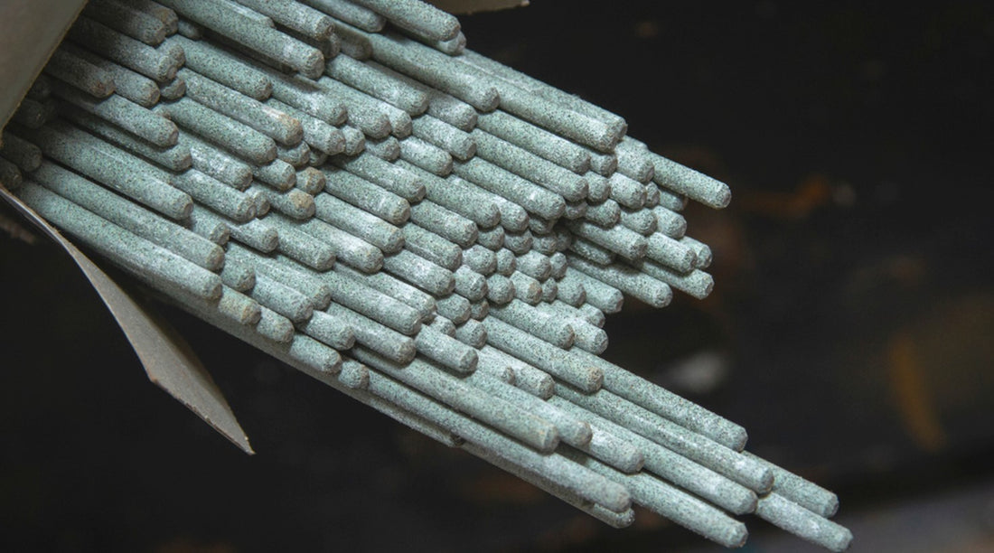 7018 welding rods sticking out of a cardboard box