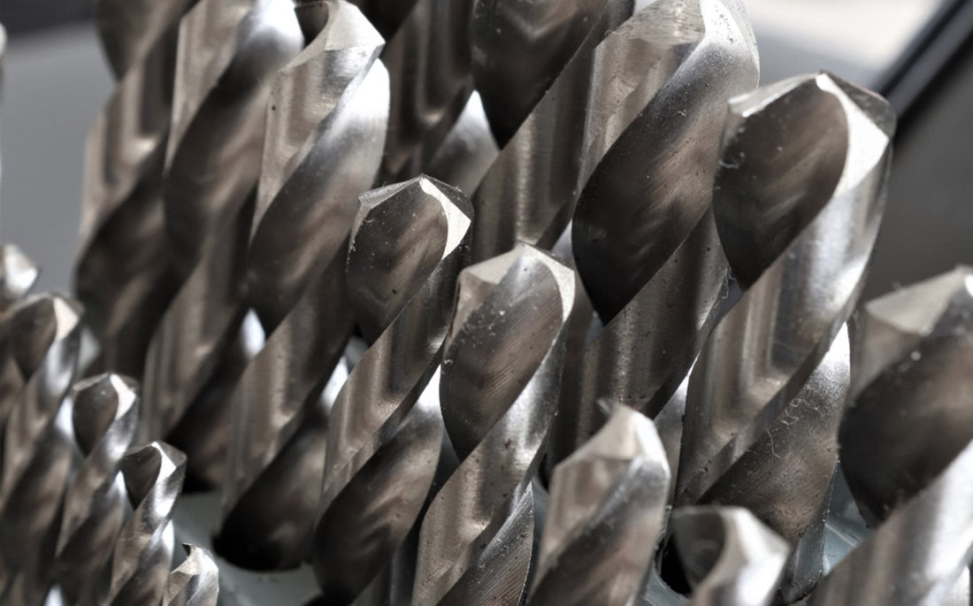 Set of drill bits for hard metal