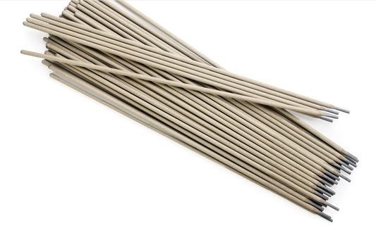 Welding electrodes in a pile on white background